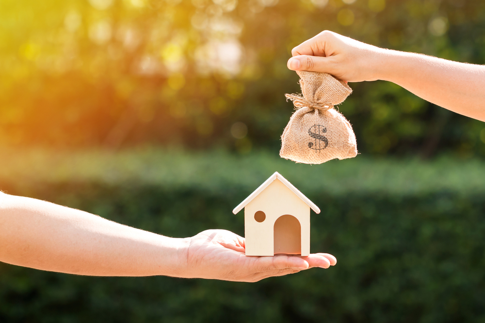 A transaction of a homeowner selling her house to Burlington's best cash buyers.