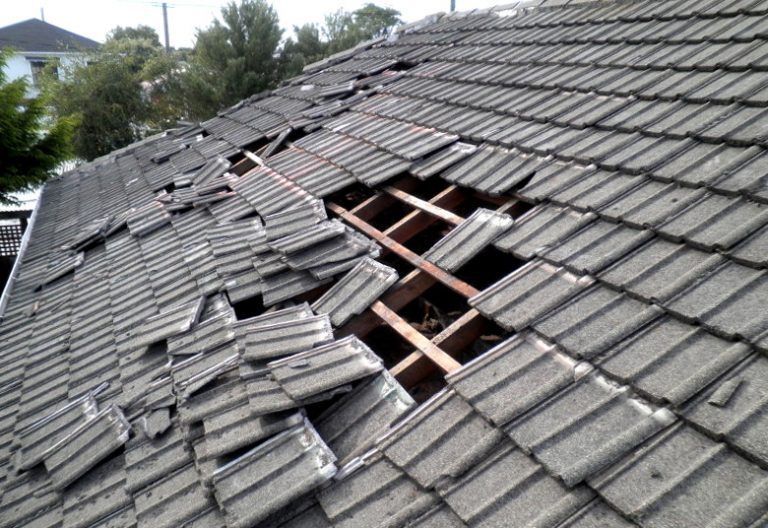A home in Burlington with a visibly damaged roof.