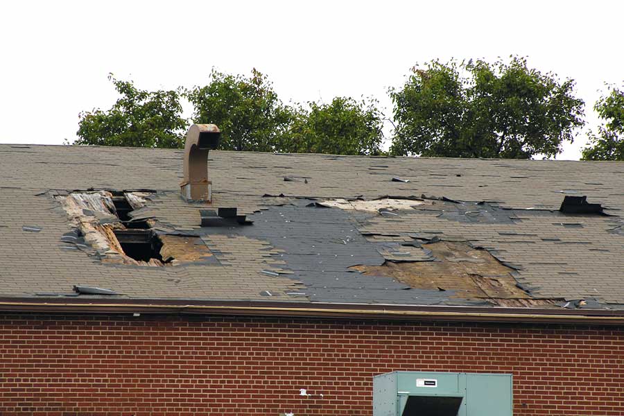 A house with a damaged roof.